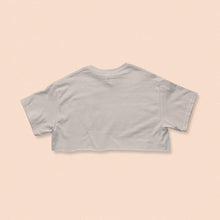 Load image into Gallery viewer, white short sleeve crop t-shirt with the face print in orange