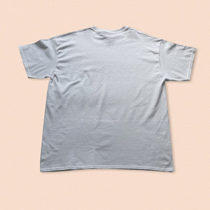 white short sleeve t-shirt with nude print in pink