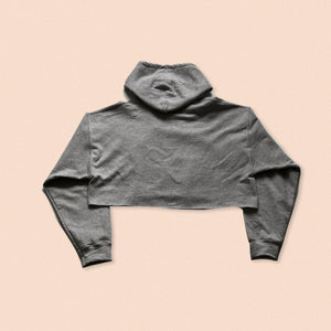 grey crop hoody with the face print in black