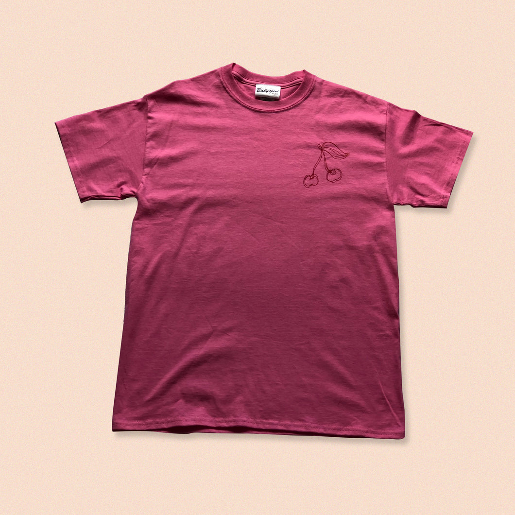 pink short sleeve t-shirt with cherry print in red