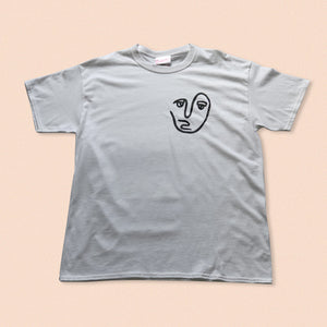 white short sleeve t-shirt with the face print in black